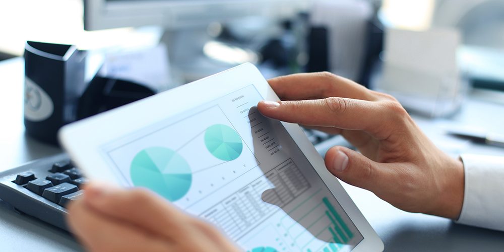 Business person analysing statistics. Business person analysing statistics.