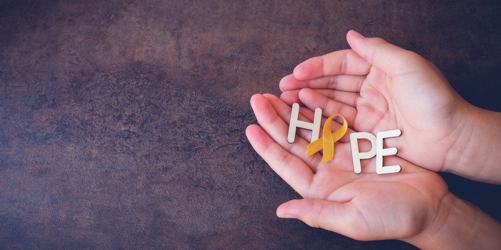 suicide awareness in the workplace Hands holding the word hope to signify suicide awareness