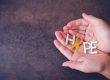 Hands holding the word hope to signify suicide awareness